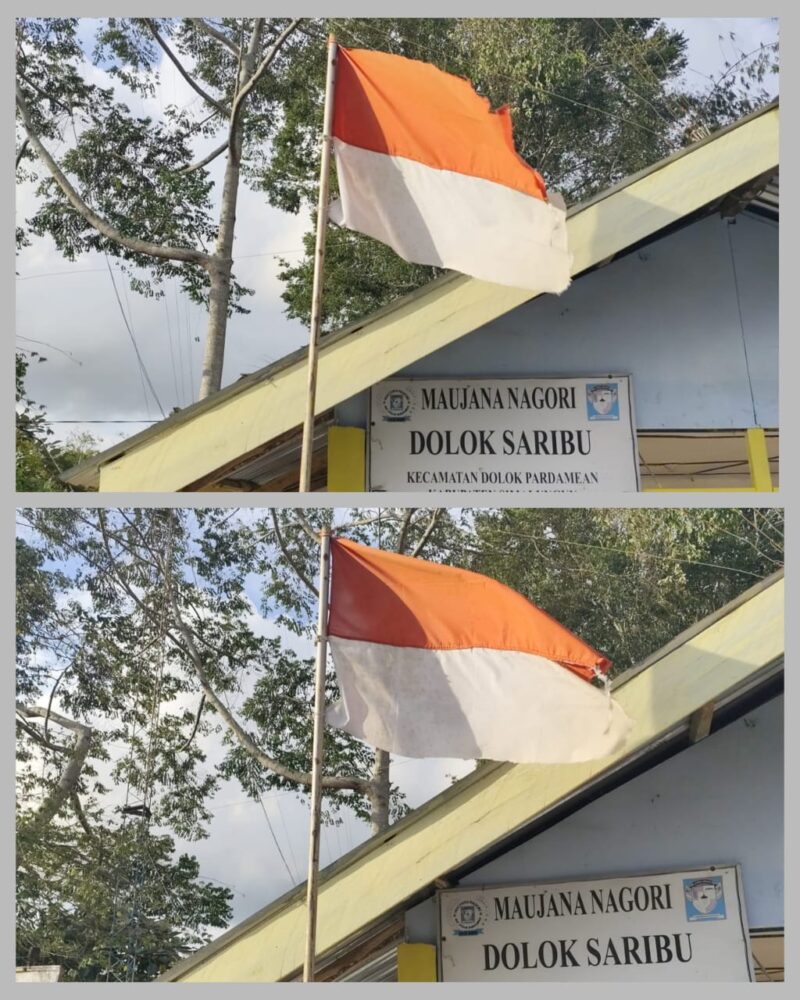 Foto : terlihat bendera merah putih robek,luntur dan kusam berkibar di kantor pangulu nagori Dolok Saribu kecamatan Dolok Pardamean Kabupaten Simalungun. 