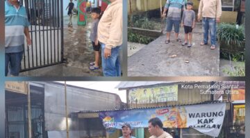 Bhabinkamtibmas Polsek Siantar Marihat Respon Cepat Tanggap Bencana Banjir di Simarimbun 